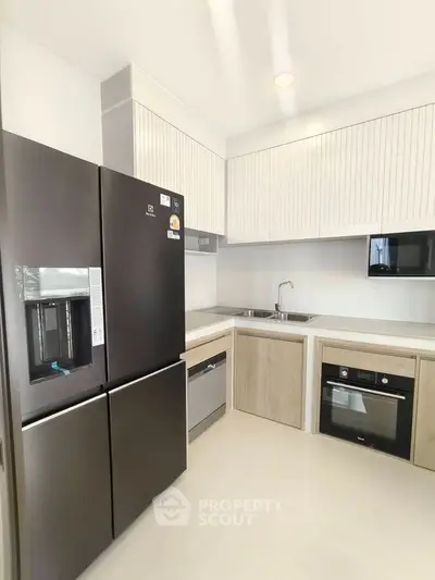 Modern kitchen with sleek appliances and minimalist design