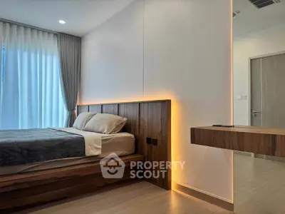 Modern bedroom with sleek wooden furniture and ambient lighting