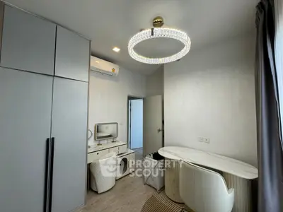 Modern bedroom with elegant chandelier and stylish furniture