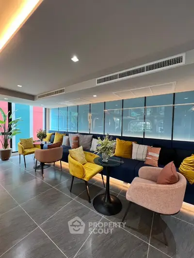 Stylish modern living room with colorful seating and elegant decor