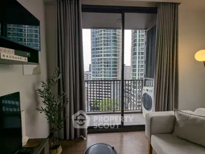 Modern living room with balcony view of city skyscrapers, featuring stylish decor and natural light.