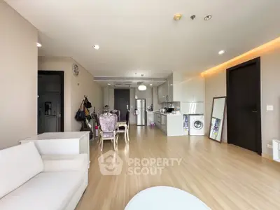 Spacious modern living room with open kitchen and elegant dining area