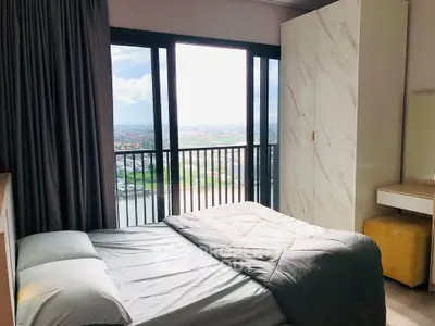 Modern bedroom with stunning city view and large windows