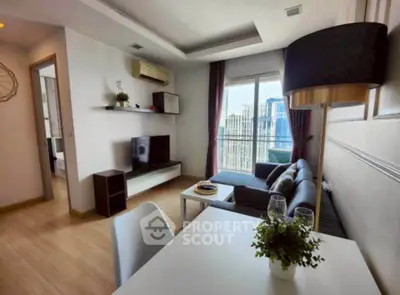 Modern living room with stylish decor and city view from balcony