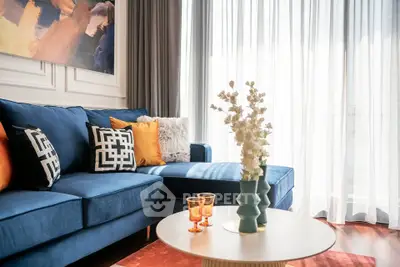 Stylish living room with blue sectional sofa and modern decor