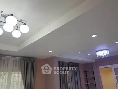 Elegant living room with modern lighting and stylish curtains