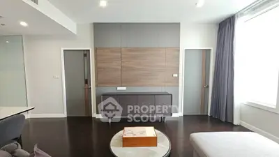 Modern living room with sleek furniture and stylish wood paneling, perfect for contemporary urban living.