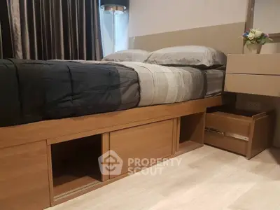 Modern bedroom with stylish bed and storage drawers, perfect for urban living.