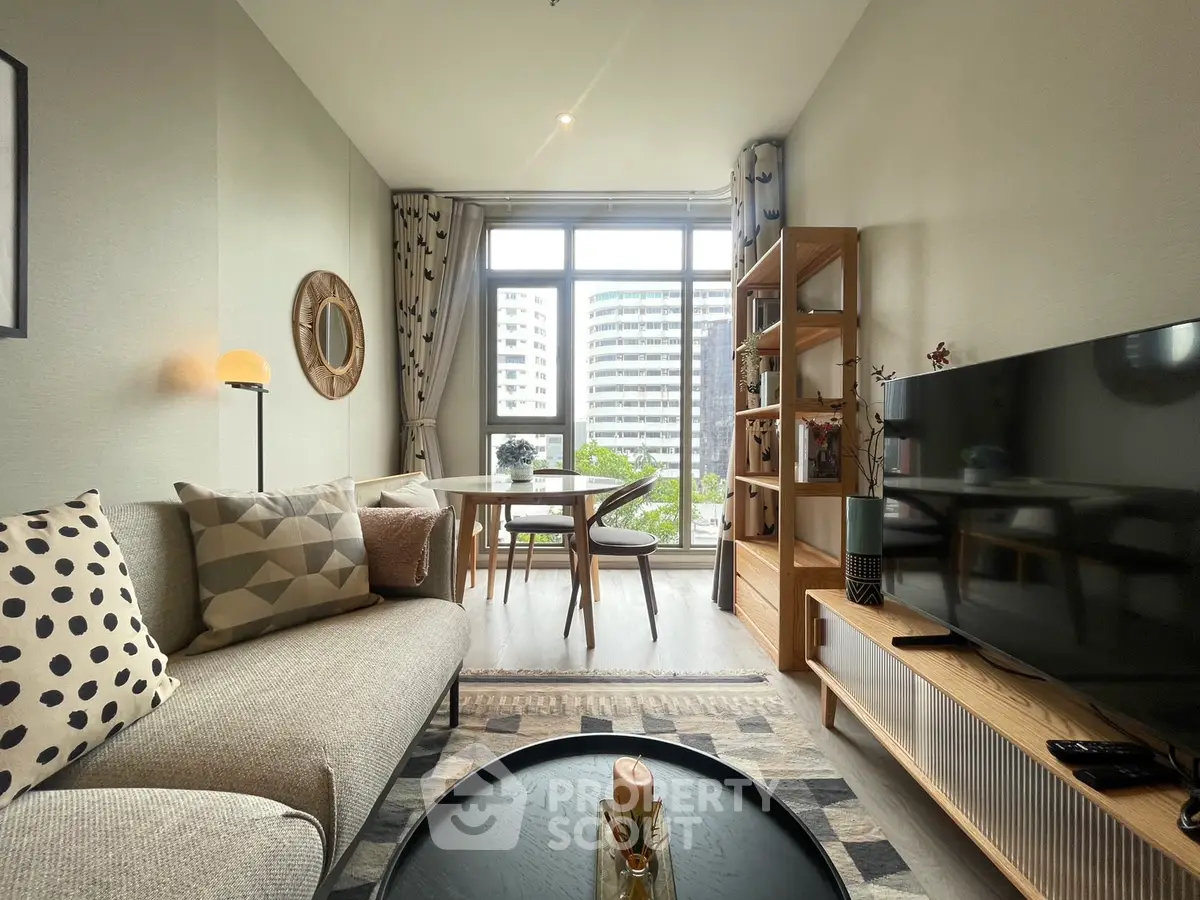 Stylish modern living room with cozy decor and large window view