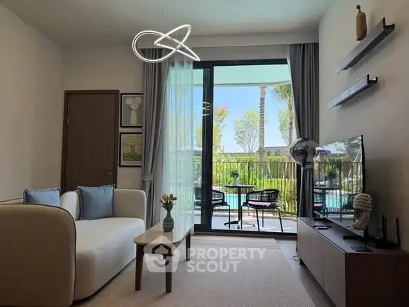 Modern living room with pool view and stylish decor