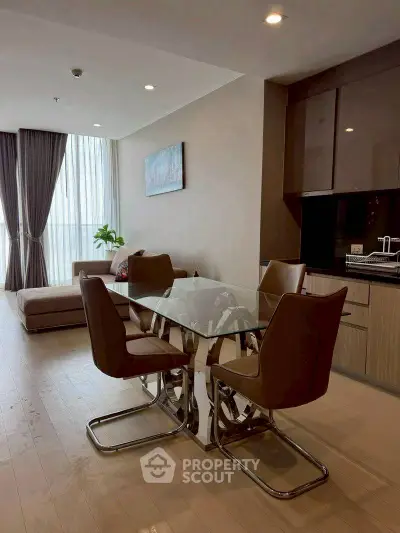 Modern living room with elegant dining area and natural light