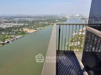 Stunning high-rise balcony with panoramic river view in urban setting