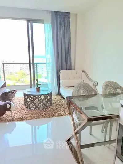 Bright living room with modern furniture and balcony view