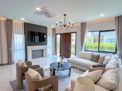 Spacious and elegant living room with modern decor and large windows offering natural light.