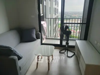 Modern living room with balcony view in high-rise apartment