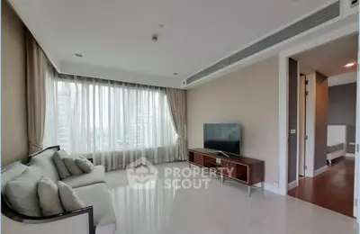 Spacious modern living room with large windows and elegant decor