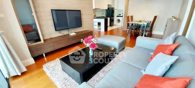 Modern living room with stylish furniture and open kitchen layout in a cozy apartment.