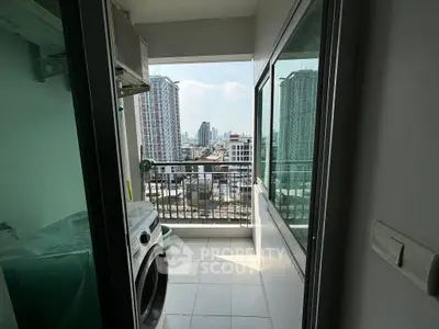 Modern apartment balcony with city view and laundry area, featuring washing machine and sleek glass doors.
