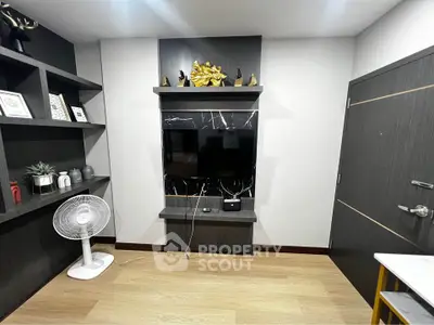 Modern living room with sleek TV setup and stylish decor