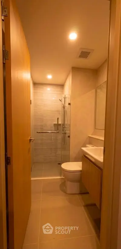 Modern bathroom with sleek design and glass shower enclosure