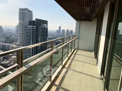 Stunning high-rise balcony with panoramic city views, perfect for urban living.