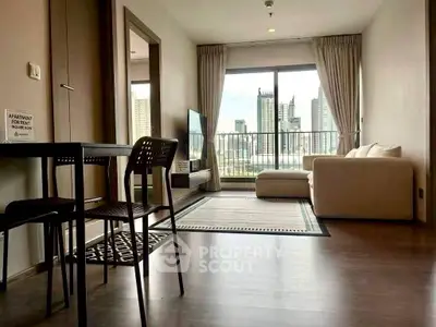 Modern living room with city view, stylish furniture, and large windows in a high-rise apartment.