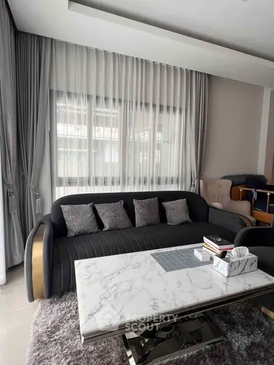 Elegant living room with modern sofa and marble coffee table