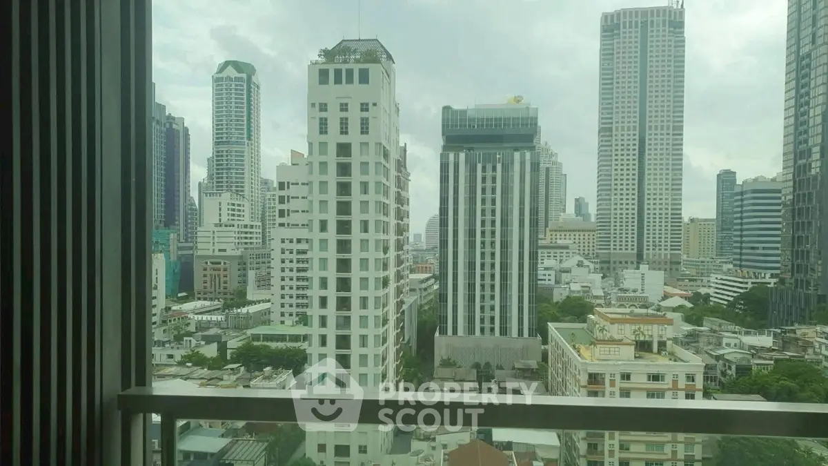 Stunning cityscape view from a high-rise balcony showcasing modern skyscrapers and urban skyline.