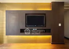 Modern living room with sleek TV wall unit and ambient lighting