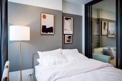 Modern bedroom with stylish decor and cozy bedding