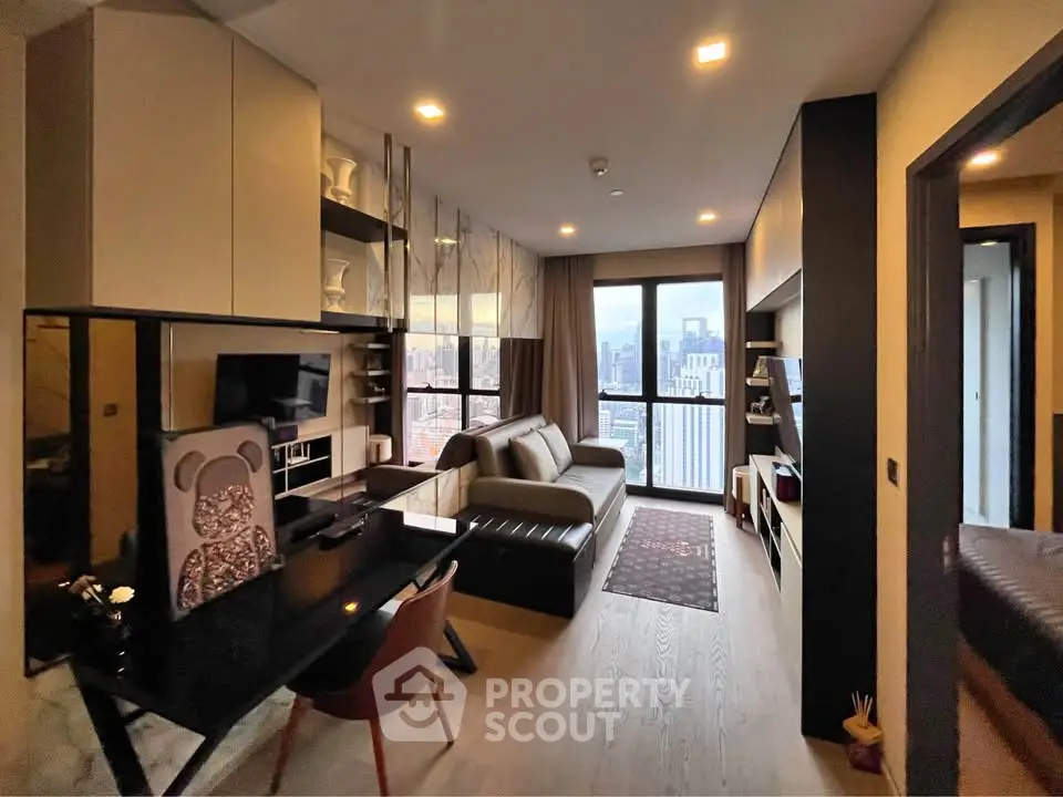 Modern living room with city view, stylish furniture, and open layout in high-rise apartment.