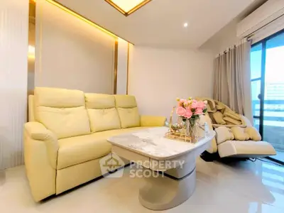 Luxurious living room with elegant beige sofa and modern decor, perfect for relaxation and entertaining.