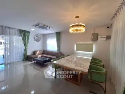 Spacious living room with elegant dining area and modern decor