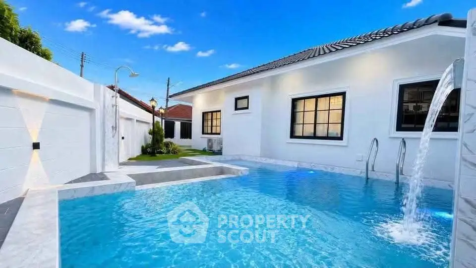 Luxurious modern home with private pool and elegant exterior design.