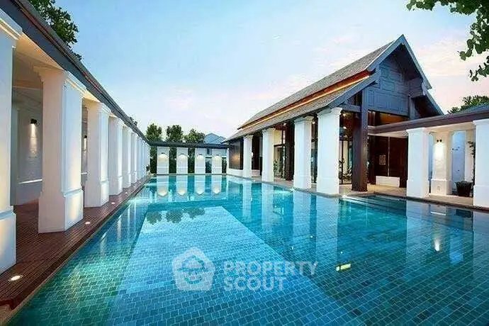 Luxurious outdoor pool area with elegant architecture and serene ambiance.
