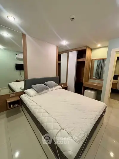 Modern bedroom with sleek design and ample storage space