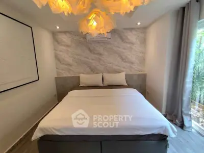 Elegant bedroom with modern lighting and stylish decor