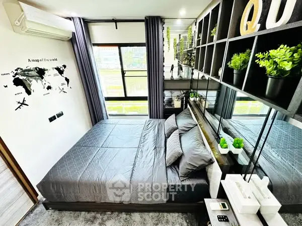 Modern bedroom with stylish decor and large window view