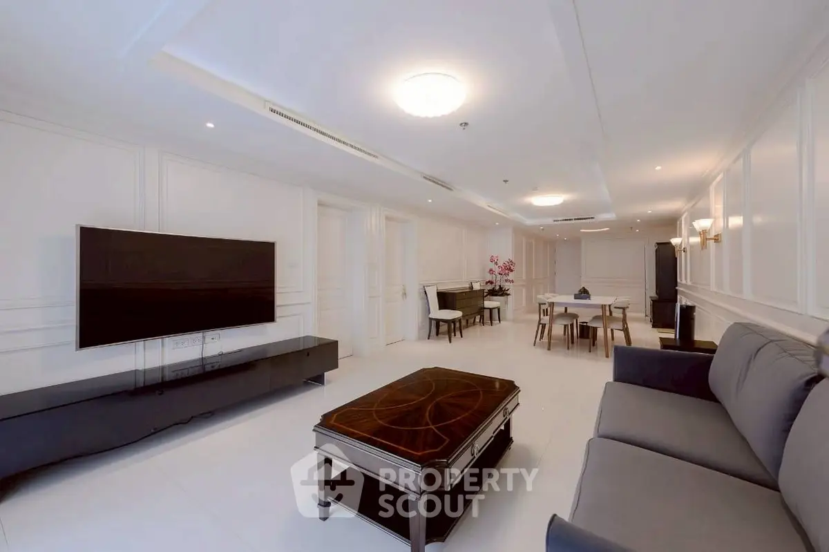 Spacious modern living room with elegant decor and large TV