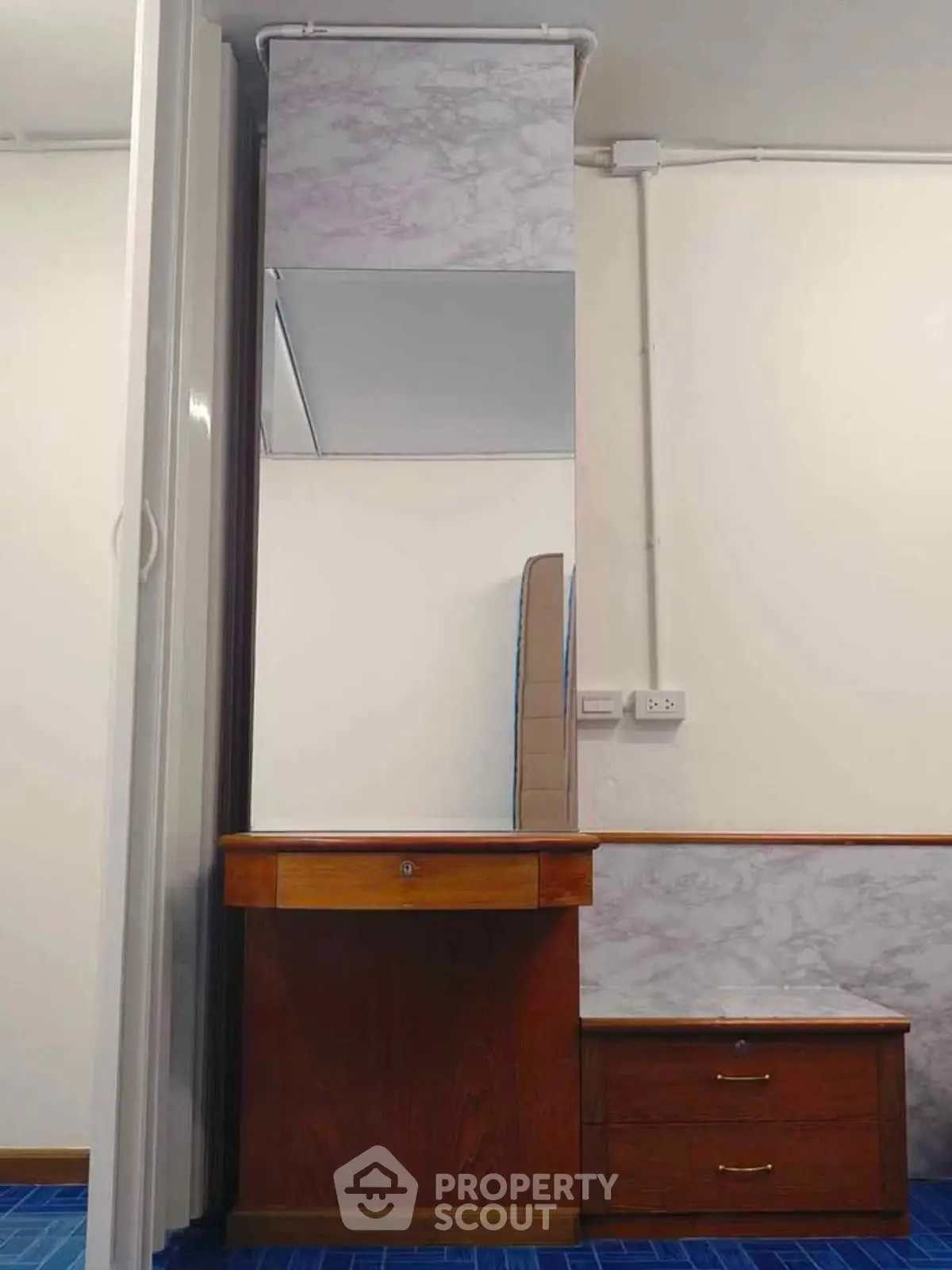 Elegant wooden vanity with mirror in a modern interior space