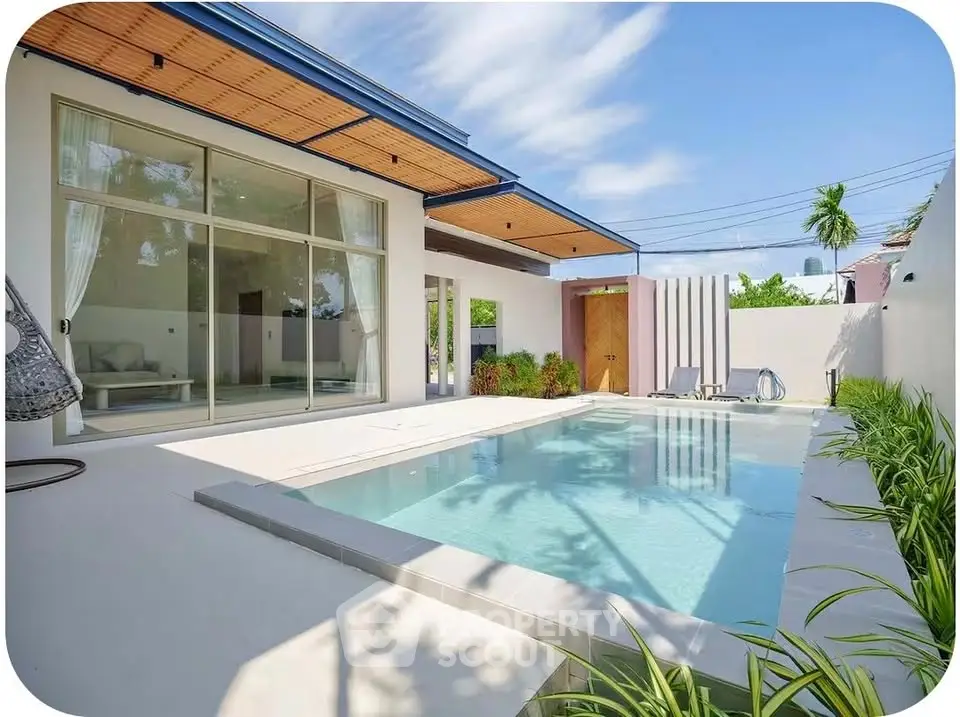 Luxurious modern home with private pool and stylish outdoor area, perfect for relaxation and entertainment.