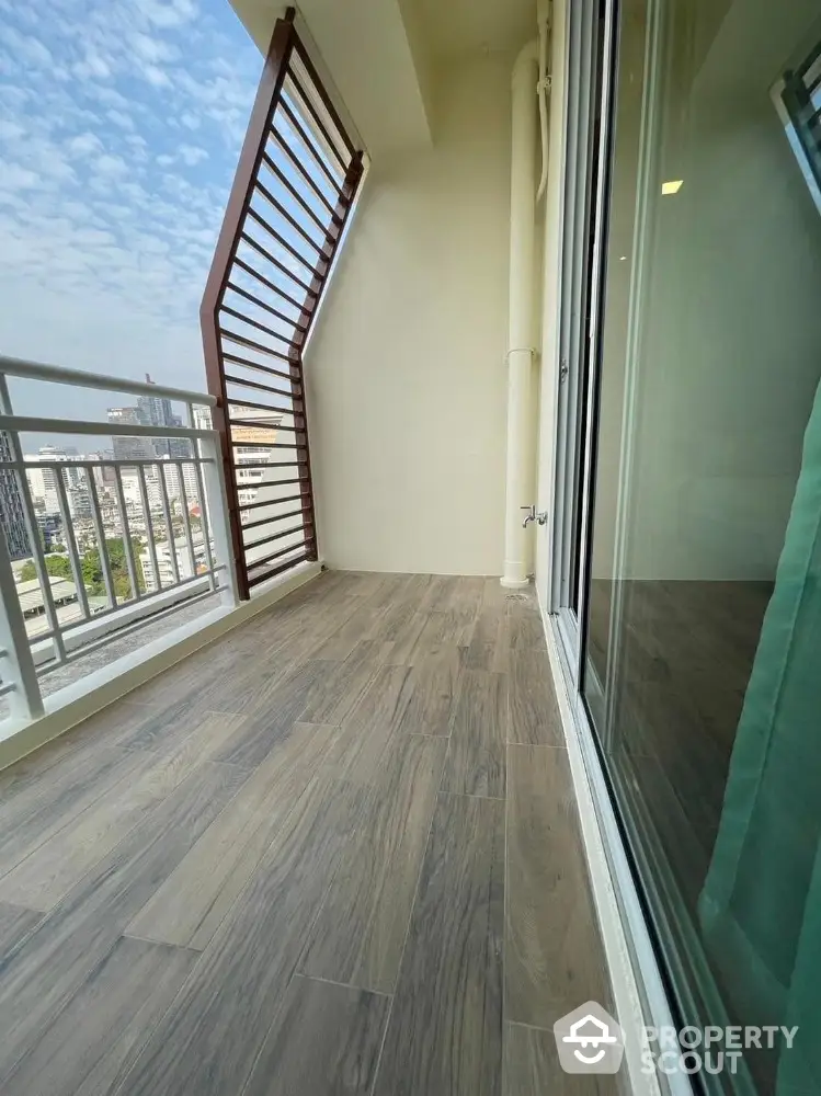 Spacious balcony with city view and modern wooden flooring