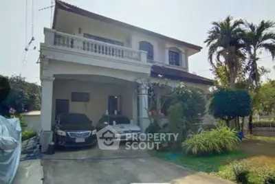 Charming two-story house with lush garden and spacious driveway