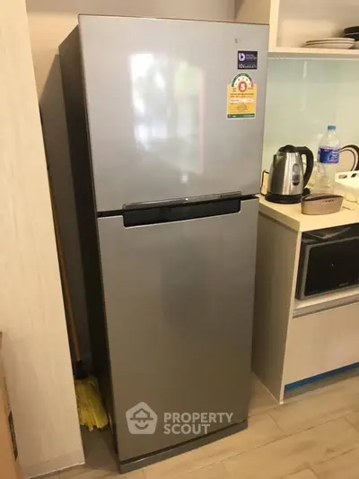 Modern kitchen with sleek refrigerator and appliances