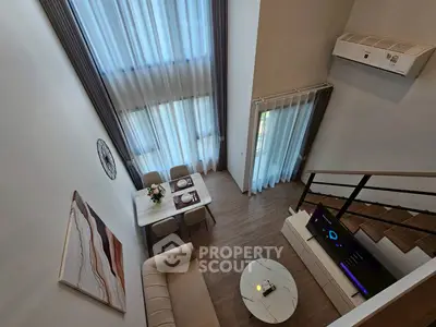 Modern duplex living room with high ceilings and stylish decor