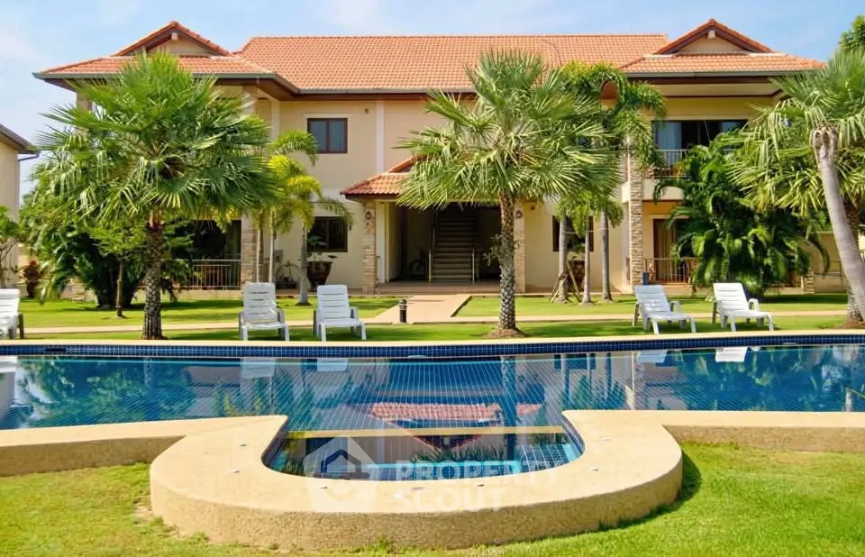 Luxurious villa with pool and lush garden, perfect for tropical living.