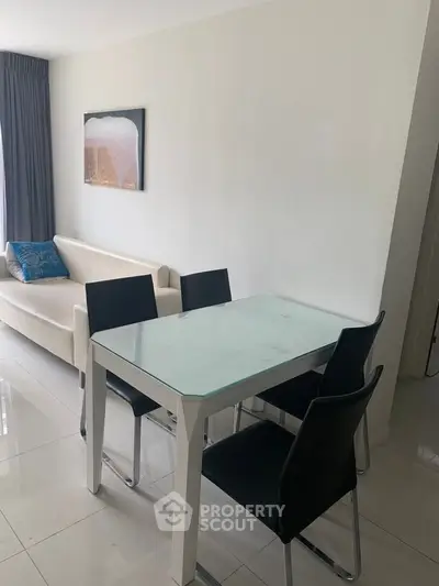 Modern living room with sleek dining table and stylish decor