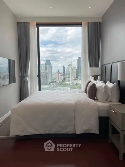 Luxurious bedroom with stunning city view through large window, modern decor and plush bedding.