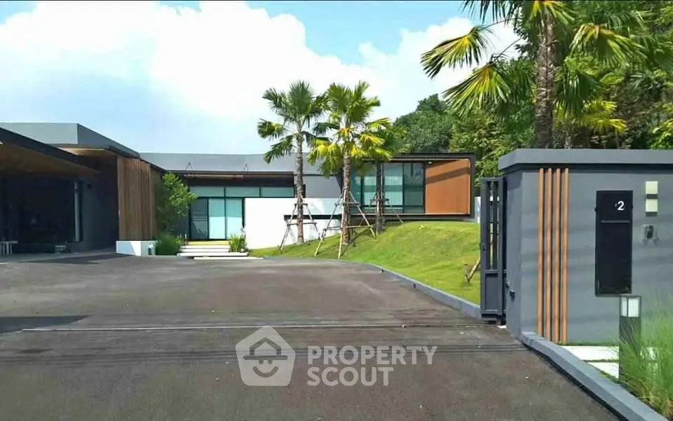 Modern luxury home with sleek design and lush landscaping