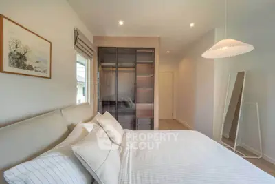 Modern bedroom with stylish decor and spacious closet